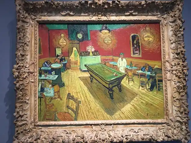 这是梵高名画《夜晚的咖啡馆》,绘于1888年.