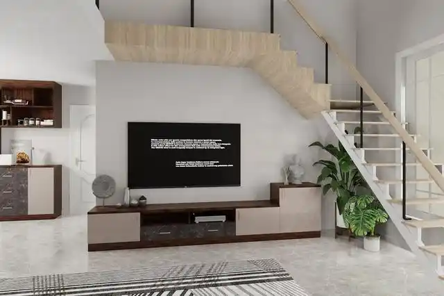 将电视和电视柜安设在楼梯下,充分利用楼下空间.