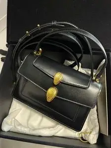 (闲置品)宝格丽亚历山大联名款双蛇头包牛皮黑色小号金扣手提单