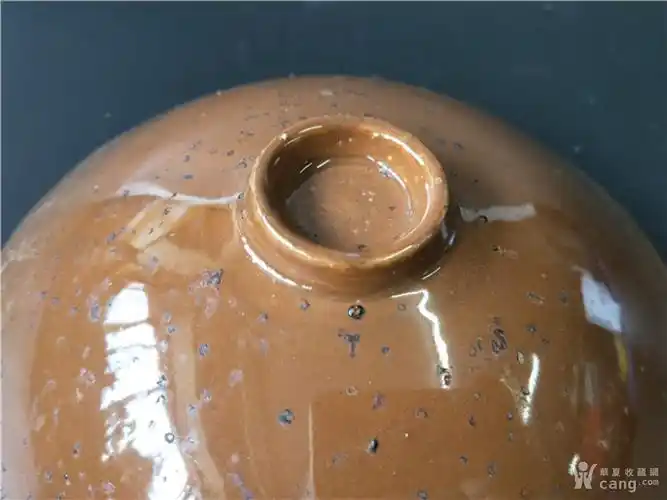 宋定窑酱釉婴戏纹碗