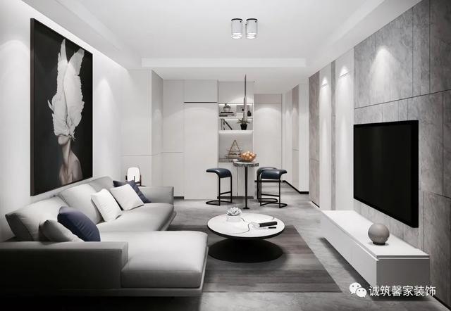 简单的l型灰色沙发,搭配悬挂的电视柜,踢脚灯,入户的小吧台构成整个