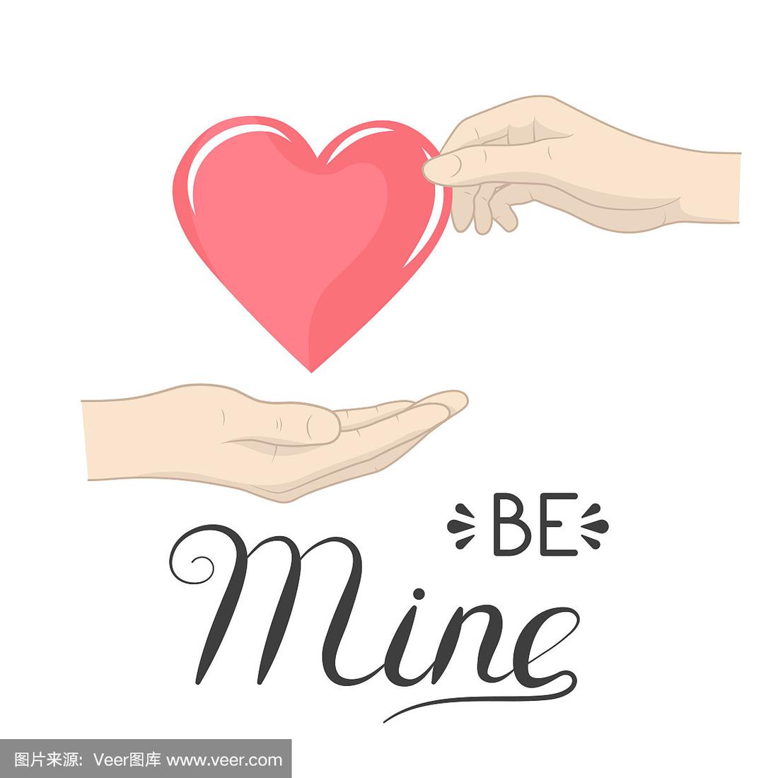 女人把一颗心交给男人,上面写着我的字作为情人节快乐或婚礼的礼物.