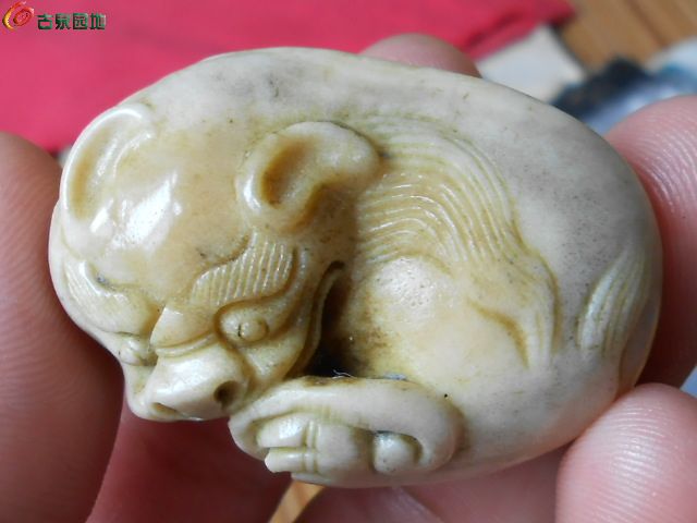 实价出;虎骨狮子把件