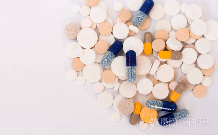 一堆五颜六色的药丸药片和瓶盖